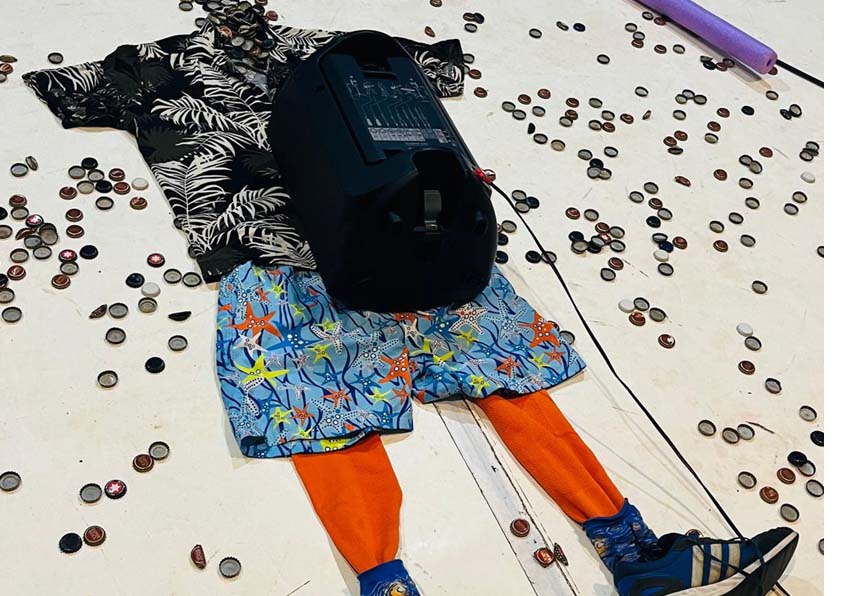 Clothes on the floor in the shape of a person